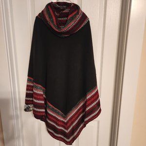 New with tags, Black Le Moda Sweater Poncho with Red, White, and Gray Accents